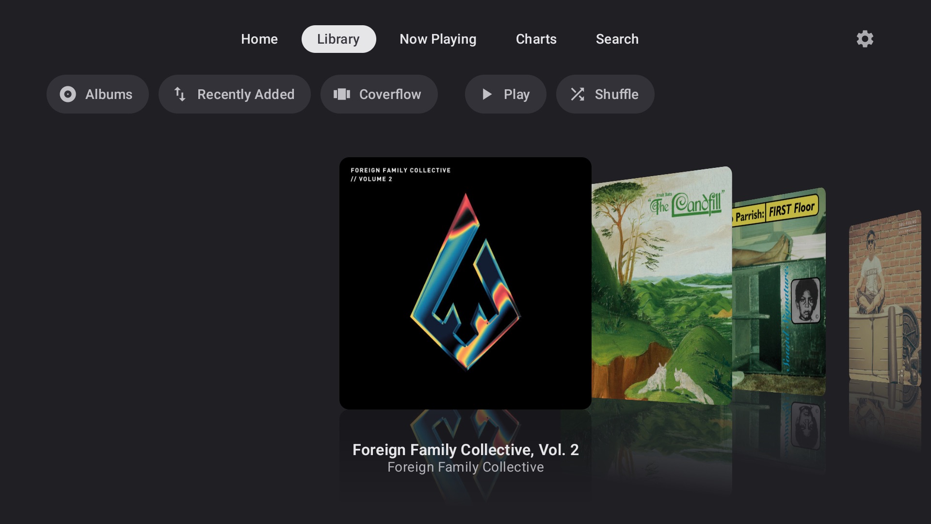 Library in Coverflow view, album art fanned out with reflections