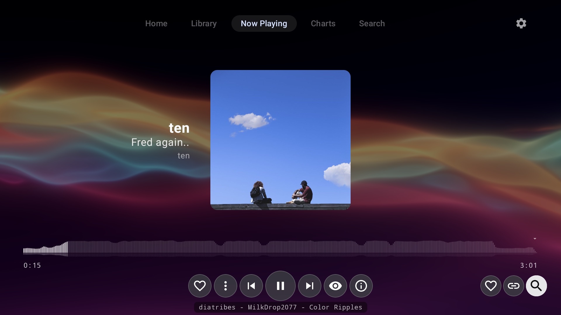 Now Playing on Android TV with a MilkDrop visualizer flowing behind the album art